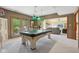 Spacious game room with a pool table and access to an adjacent living space at 965 W Main St, Greenwood, IN 46142