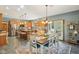 Well-lit kitchen and dining space with wood cabinets, large island, and room for dining table at 965 W Main St, Greenwood, IN 46142