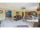Bright living room with neutral carpet and a view to a game room at 965 W Main St, Greenwood, IN 46142