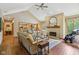 Inviting living room featuring a fireplace, hardwood floors, and vaulted ceilings at 965 W Main St, Greenwood, IN 46142