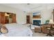 Spacious main bedroom featuring tray ceilings, fireplace, sitting area and ensuite bathroom access at 965 W Main St, Greenwood, IN 46142