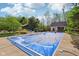View of the backyard with pool covered, gazebo, pool house and the manicured lawn at 965 W Main St, Greenwood, IN 46142