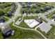 Aerial shot of community amenities, including a sparkling pool, playground and lush green spaces at 9822 Tampico Chase, Fishers, IN 46040