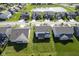 Aerial view of the neighborhood featuring lush green lawns and a serene pond with a fountain at 9822 Tampico Chase, Fishers, IN 46040
