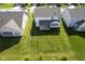 Aerial view showing a spacious backyard with healthy green grass and a covered patio at 9822 Tampico Chase, Fishers, IN 46040