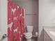 Bathroom featuring a toilet and a shower with a decorative pink curtain at 9822 Tampico Chase, Fishers, IN 46040