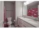 Bathroom featuring double sinks, a toilet and a shower with curtain at 9822 Tampico Chase, Fishers, IN 46040