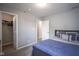 Cozy bedroom featuring plush carpet, closet, and grey walls and blue bedding at 9822 Tampico Chase, Fishers, IN 46040