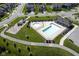 Aerial view of a community pool and playground in a well-maintained neighborhood at 9822 Tampico Chase, Fishers, IN 46040