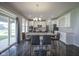 Elegant dining area with ample seating, and sliding glass doors that bring in natural light at 9822 Tampico Chase, Fishers, IN 46040