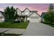 Charming two-story home with a well-manicured lawn and a spacious two car garage, perfect for Gathering living at 9822 Tampico Chase, Fishers, IN 46040