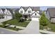 Well-kept two-story home with a two-car garage, landscaped yard, and welcoming front porch at 9822 Tampico Chase, Fishers, IN 46040