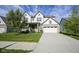 Charming two-story home with a well-manicured lawn and a spacious two car garage, perfect for Gathering living at 9822 Tampico Chase, Fishers, IN 46040