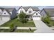 Beautiful two-story home with manicured lawn, two-car garage, and a welcoming front porch at 9822 Tampico Chase, Fishers, IN 46040