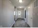 Inviting entryway with wood floors and neutral walls, leading to a bright front door at 9822 Tampico Chase, Fishers, IN 46040