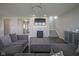 Open-concept living room featuring a fireplace, staircase, and view into the entryway at 9822 Tampico Chase, Fishers, IN 46040