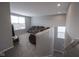 Upstairs living room includes gray walls, gray carpet, and plush, reclining couches at 9822 Tampico Chase, Fishers, IN 46040