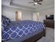 Spacious main bedroom featuring a ceiling fan, ensuite access and carpet at 9822 Tampico Chase, Fishers, IN 46040