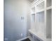 Mudroom features a storage bench with cubbies and hooks to help organize coats, backpacks, and shoes at 9822 Tampico Chase, Fishers, IN 46040
