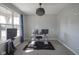 Well-lit office featuring a modern desk with dual monitors, large window and decorative chandelier at 9822 Tampico Chase, Fishers, IN 46040