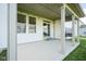 Covered patio features a grill, ceiling lights, and access to the backyard and house at 9822 Tampico Chase, Fishers, IN 46040
