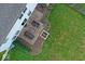 Aerial view of backyard patio featuring comfortable outdoor seating and a cozy brick fire pit at 10316 Hatherley Way, Fishers, IN 46037