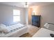 Bedroom with light walls, carpet, window, desk, and dresser at 10316 Hatherley Way, Fishers, IN 46037