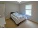 Cozy bedroom with a comfortable bed, natural light, and neutral decor at 10316 Hatherley Way, Fishers, IN 46037