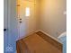 Welcoming foyer featuring a front door with decorative glass, hardwood flooring, and neutral wall paint at 10316 Hatherley Way, Fishers, IN 46037