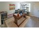 Bright home office featuring a large executive desk, three monitors, and custom shelving at 10316 Hatherley Way, Fishers, IN 46037