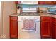 Kitchen close up showing gas stove, oven, cabinets, and countertops at 10316 Hatherley Way, Fishers, IN 46037