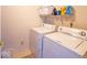 Laundry room with washer and dryer and storage shelf at 10316 Hatherley Way, Fishers, IN 46037