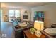 Bright living room showcasing a fireplace, comfortable seating, and a view of the backyard at 10316 Hatherley Way, Fishers, IN 46037
