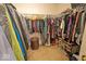 Walk-in closet with extensive shelving and clothing racks for organized storage at 10316 Hatherley Way, Fishers, IN 46037