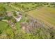 Scenic aerial view of a country home featuring surrounding trees and spacious green lawn at 10473 N County Road 950 E, Brownsburg, IN 46112