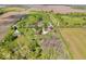 Wide aerial perspective capturing a property with houses, fields, and a picturesque tree line at 10473 N County Road 950 E, Brownsburg, IN 46112