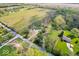 Aerial view of the property, featuring fields, trees and home at 10473 N County Road 950 E, Brownsburg, IN 46112