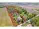 Aerial view of property showing boundaries, home, trees, and surrounding fields at 10473 N County Road 950 E, Brownsburg, IN 46112