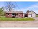 Charming single-story brick home with a detached garage and a welcoming front porch at 10473 N County Road 950 E, Brownsburg, IN 46112