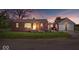 Charming single-story brick home featuring a detached garage and inviting front porch at 10473 N County Road 950 E, Brownsburg, IN 46112