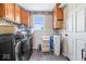 Laundry room featuring washer and dryer, overhead cabinets, and a window at 10473 N County Road 950 E, Brownsburg, IN 46112
