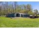 View of an outbuilding with hay bales in a grassy field at 10473 N County Road 950 E, Brownsburg, IN 46112