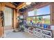 Shed featuring boot and shoe rack near a large window with yard views at 10473 N County Road 950 E, Brownsburg, IN 46112