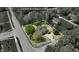 Aerial shot of a tan house with lot lines outlined and set amongst mature trees at 10602 Fall Rd, Fishers, IN 46037
