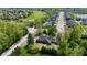 An aerial shot of a home near a golf course, complemented by neat streets and greenery at 10602 Fall Rd, Fishers, IN 46037