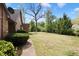 Lush backyard with mature trees and green lawn at 10602 Fall Rd, Fishers, IN 46037