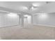 Large basement features neutral walls, neutral carpeting, and built in storage at 10602 Fall Rd, Fishers, IN 46037