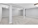 Spacious unfinished basement with support beams, neutral carpeting, and large openings at 10602 Fall Rd, Fishers, IN 46037