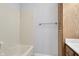 Bathroom with a tub and built in storage shelves at 10602 Fall Rd, Fishers, IN 46037