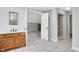 Bathroom with double sinks, vanity, mirror, and tile flooring at 10602 Fall Rd, Fishers, IN 46037